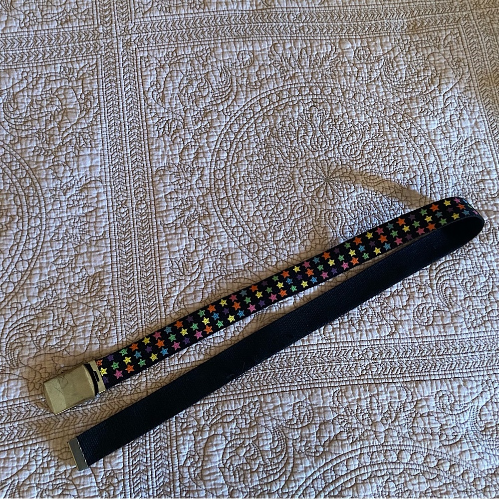 Black seatbelt style belt with colourful stars